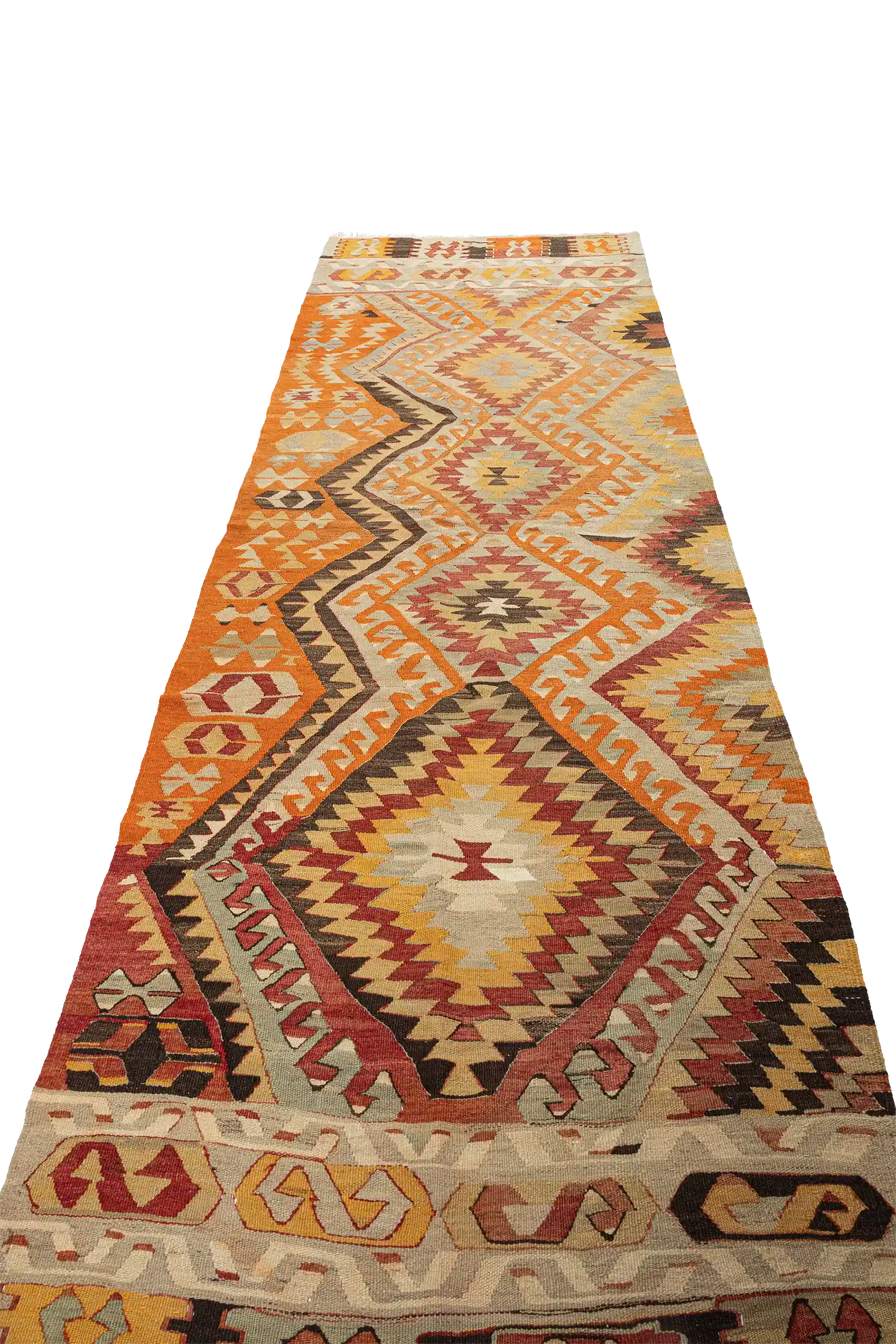 Perspektivische Ansicht – betont das zentrale Muster mit gezackten Rändern und warmen Erdfarben, darunter Orange, Ocker, Ziegelrot und Creme