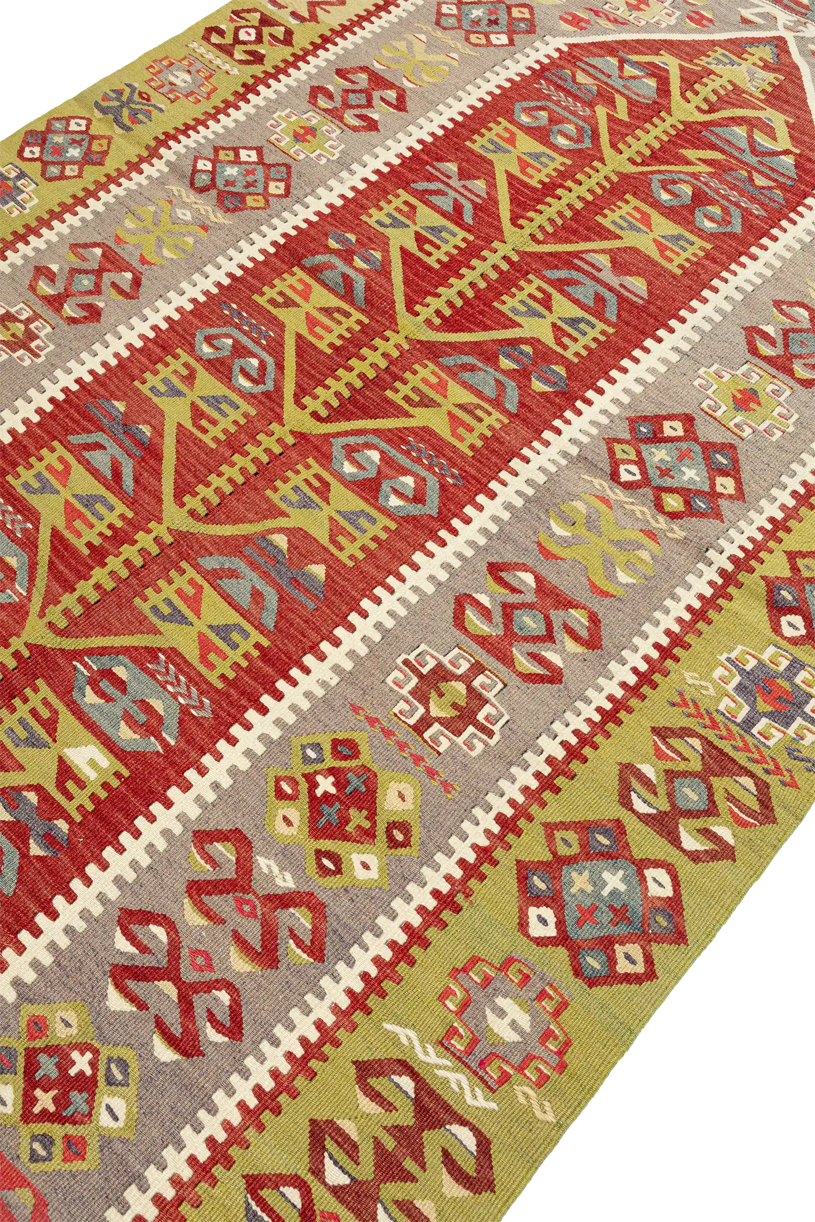 Schräge Seitenansicht des Kelims – betont die klare Struktur der zentralen Musterachse sowie die angrenzenden Bordüren und Außenfelder