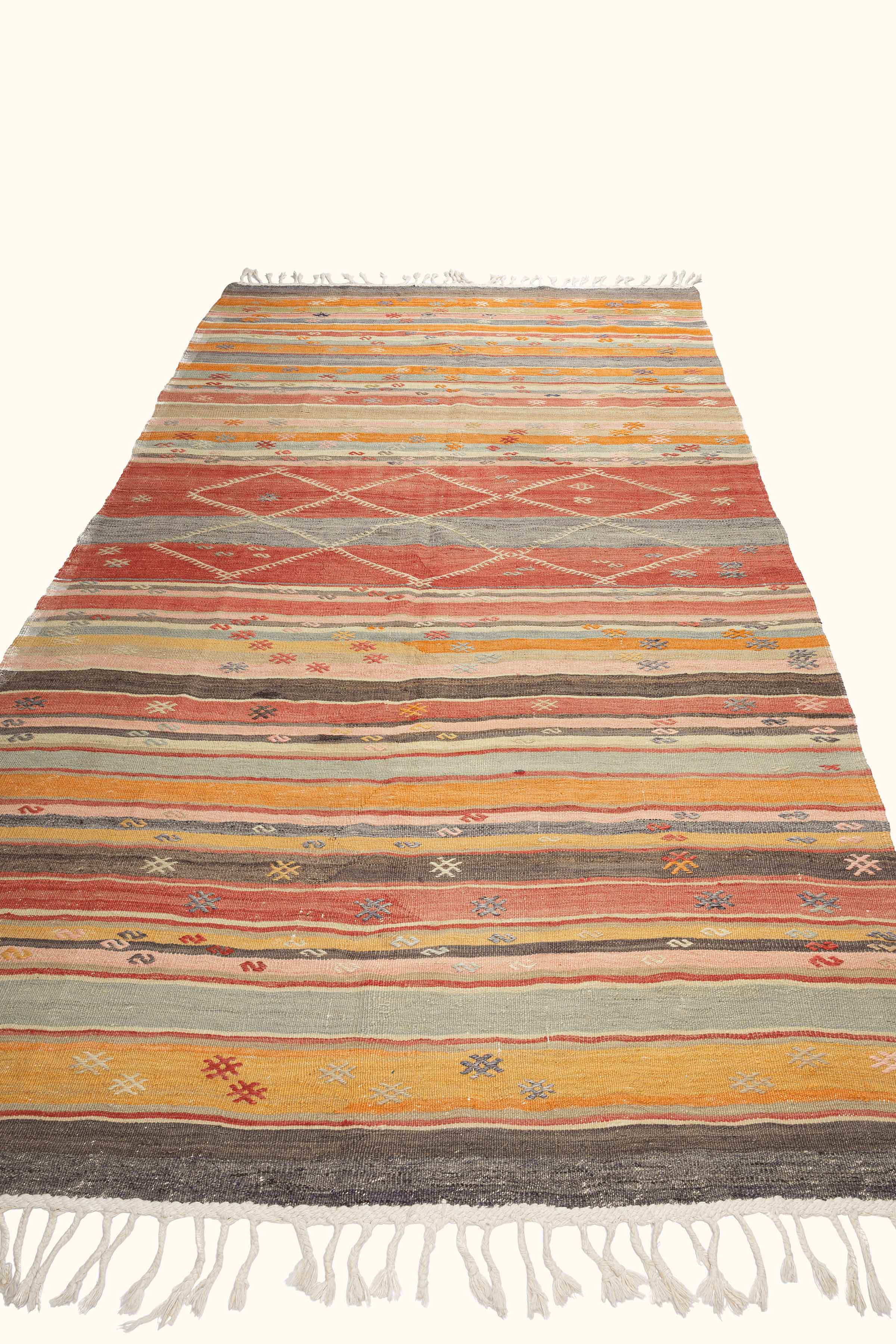 Perspektivische Ansicht – warme Streifen in Ziegelrot, Safran und Olivgrün