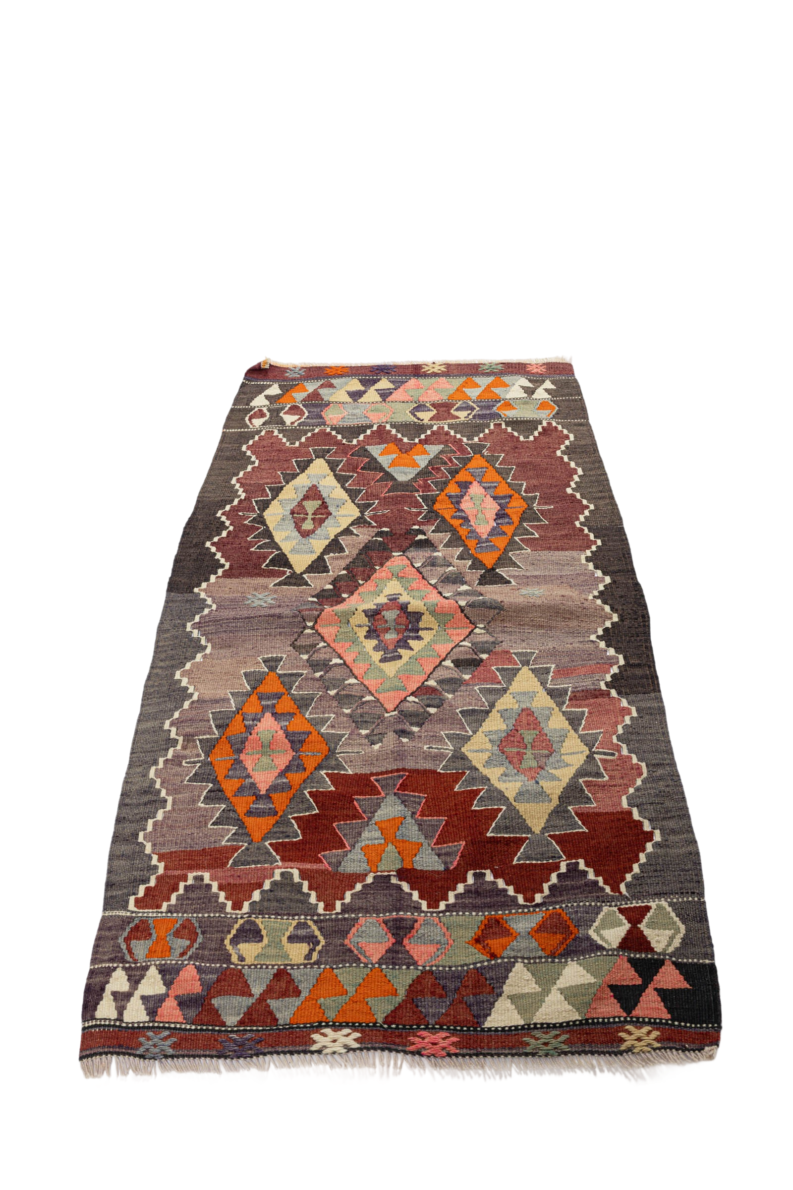 a multicolored rug on a black background